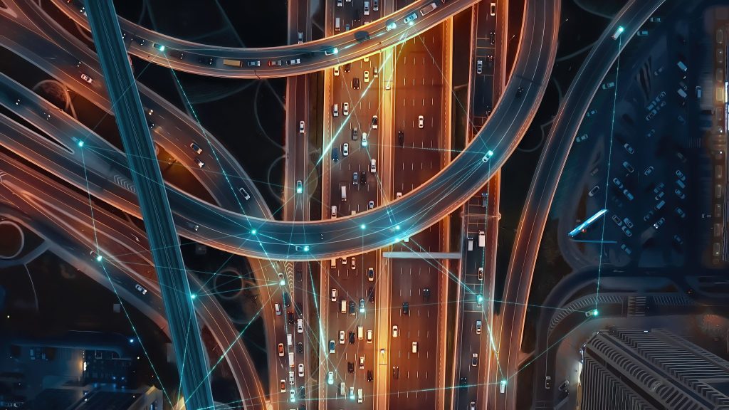 Overhead motorway network with connected vehicles illustrating live delivery tracking